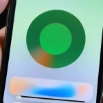 what_does_the_small_green-orange_circle_represent_appear_on_the_screen_of_the_iphone_operating_system_ios_14-0